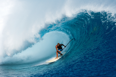 Laird Hamilton, Co-Founder of Laird Superfood, paddleboarding Teahupo’o in Tahiti (Photo: Business Wire)