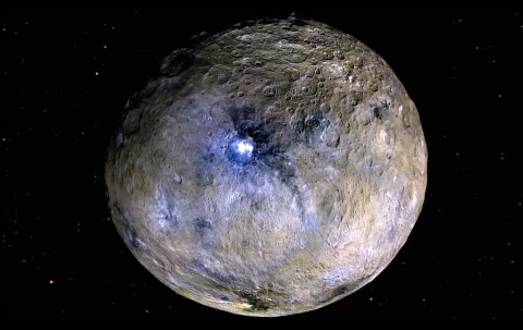 The dwarf planet Ceres is shown, including bright features revealed by Dawn at the Occator Crater that continue to spark scientific investigation. Image Credit: NASA/JPL-Caltech/UCAL/MPS/DLR/IDA