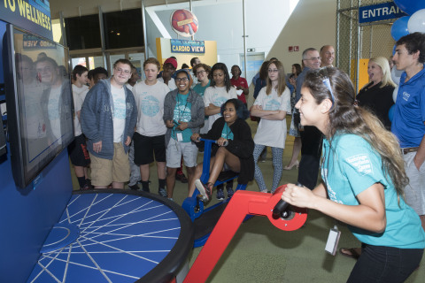 A group of summer camp students race each other at the new "Cycling to Wellness" exhibit that opened today at the Connecticut Science Center. The exhibit is sponsored by UnitedHealthcare and challenges riders to a virtual cycling race while teaching users about the importance of exercise and a healthy diet (Photo: Alan Grant).