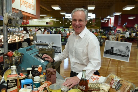 Southeastern Grocers’ Chief Operating Officer Anthony Hucker poses with a 1956-themed check out lane during Winn-Dixie’s 60th Anniversary celebration. (Photo: Business Wire)