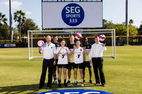 Ian McLeod, President and CEO of Southeastern Grocers, Mark Frisch, Owner and CEO of Jacksonville Armada FC, players from the Armada FC and the youth YMCA players, Avery Cannon and Macie Faucett, unite together at Community First to announce the launch of SEG Sports - the grocer’s commitment to fuel, coach and inspire healthy lifestyles within the community. (Photo: Business Wire)