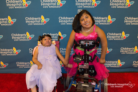 From Left: Teresa Cajas joins her sister Josie Hull on the red carpet at Children's Hospital Los Angeles. The formerly conjoined twins, 15, are celebrating their Quinceanera. (Photo: Business Wire)