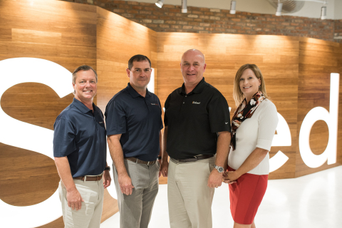 iSolved Executives stand together at their new Salt Lake City location. (From left to right) Chief Financial Officer, Shane Whittington; Chief Commercial Officer, John Vallely; Chief Executive Officer, Dave Dawson; Chief Marketing Officer, Trish Stromberg. (Photo: Business Wire)