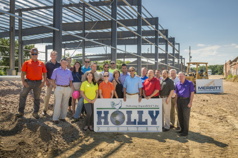 Merritt and Holly employees pose for a group photo in front of Holly's future poultry processing facility. (Photo: Business Wire)