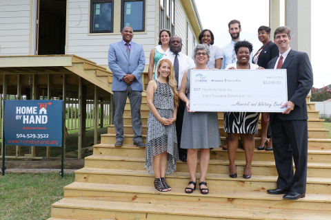 The Federal Home Loan Bank of Dallas and Whitney Bank awarded Home by Hand, a New Orleans nonprofit and affordable housing developer, $8,000 in Partnership Grant Program funds during a check presentation today. (Photo: Business Wire)