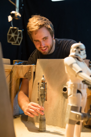 Stop-motion animator and director Tucker Barrie preparing the Jedha Marketplace set. (Photo: Business Wire)