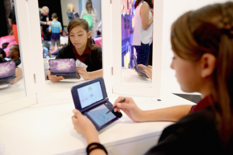 In this photo provided by Nintendo of America, Sophia S. from Compton, California, plays the Style Savvy: Fashion Forward game on the New Galaxy Style New Nintendo 3DS XL system, available now for a suggested retail price of $199.99, at Big Door Studios in El Segundo, California, on Aug. 30, 2016. In Style Savvy: Fashion Forward, players can manage their own boutique, design clothes, style hair, master the art of makeup and become the next top model. (Photo by Jonathan Leibson/Getty Images for Nintendo)