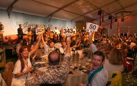 Bidders support the Sonoma Harvest Wine Auction highest grossing lot of the day, the Fund the Future Lot which supports the Sonoma County wine industry’s childhood literacy initiative. Photo by George Rose