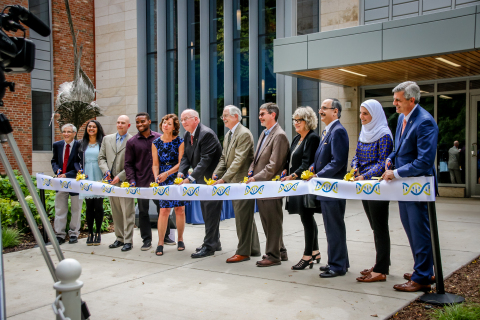 University of Michigan-Dearborn celebrates the opening of the Natural Sciences Building. On hand to cut the ribbon were Department of Natural Sciences Chair John Thomas, Student Government President Fiana Arbab, Staff Senate Chair Bryan Earl, Biology Club President Ekene Ezeokoli, Psychology Professor and Faculty Senate Chair Nancy Wrobel, Chancellor Daniel Little, Physics and Astronomy Interim Chair Don Bord, College of Arts, Sciences, and Letters Dean Marty Hershock, Provost Kate Davey, State Representative George Darany, Chemistry Club President Latifa Dabaja and alumnus Eric Nemeth. (Photo: Business Wire)