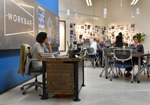 Workbar members sit in the cafe area of the Workbar at Staples location on Tuesday, Sept. 13, 2016 in Brighton, Mass. Staples and Workbar are creating more productive workspaces with coworking locations within three Massachusetts Staples stores. (Josh Reynolds /AP Images for Staples)