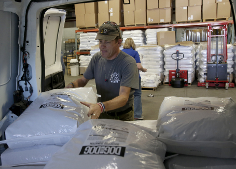 Pima Animal Care Center (PACC) Off-Site Adoptions Coordinator Mark Little unloads a recent shipment of 300,000 DOG for DOG meals distributed through PetSmart Charities for pets in need in the Tucson area. This delivery completed a one million-plus meal donation across North America from PetSmart's philanthropic pet food brands, providing meals for more than 20,000 dogs in need and allowing PACC to use its annual food budget of $80,000 to provide services. (Photo: Business Wire)