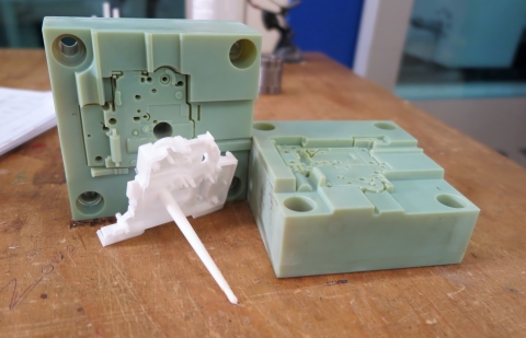 3D printed injection mold with resulting part, produced on a Stratasys Objet Connex 3D Printer (Photo: Business Wire).