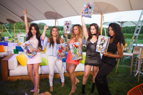 The members of Fifth Harmony celebrate the premiere of their DC Super Hero Girls "That's My Girl" music video collaboration by striking a pose with their favorite DC Super Hero Girls Action Doll. (Photo Cred: Warner Bros Consumer Products and DC Entertainment / Product Cred: Mattel)