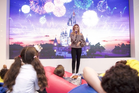 In this photo provided by Nintendo of America, Olivia Holt meets with young fans at the Enchanted Ball Event at Nintendo NY to celebrate the upcoming launch of the Disney Magical World 2 game for the Nintendo 3DS family of systems on Oct. 14.