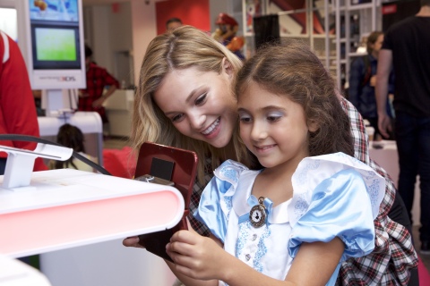 In this photo released by Nintendo of America, guests are treated to a special preview event of the Disney Magical World 2 video game for the Nintendo 3DS family of systems ahead of its release on Oct. 14. Hosted by Hollywood Records recording artist Olivia Holt, players explored Castleton, a world full of Disney characters.