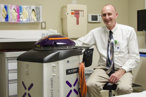 Stopping infections starts with killing the superbugs that cause them. Genesis Healthcare has deployed a Xenex Germ-Zapping Robot to destroy the germs and bacteria that pose a risk to patient safety. Daniel Scheerer, M.D., Chief Medical Affairs Officer for Genesis, poses with the hospital's new robot. (Photo: Business Wire)