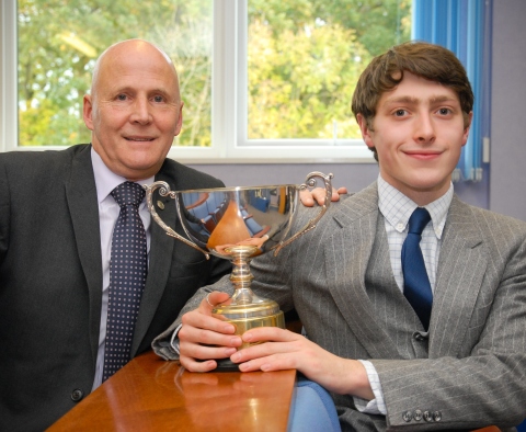 Simon Marshall presents the Guild Trophy to the 2016 Apprentice of the Year, Tom Woods (Photo: Business Wire)