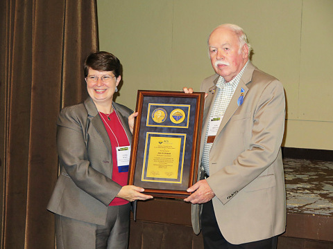 Jack Driscoll (PID Analyzers), at right, receiving the E. Ann Nalley Volunteer Service Award from Laura Pence (University of Hartford), ACS District I Director. Photo by M.Z. Hoffman (Photo: Business Wire) 
