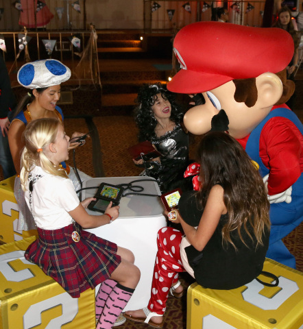 In this photo provided by Nintendo of America, guests of Starlight Children’s Foundation’s “Dream Halloween” event on Oct. 22 in Los Angeles got to meet Mario – one of the stars of the Mario Party Star Rush game. Available for the Nintendo 3DS family of systems starting Nov. 4, Mario Party Star Rush is packed with modes that players of all ages will love. The rapid-fire party game lets players think fast, play fast and have a blast. (Photo: Business Wire)