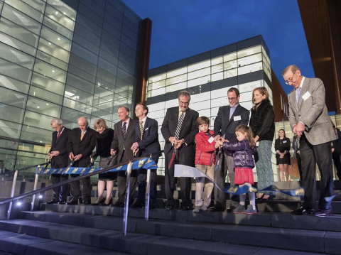 Guests at the ribbon-cutting and dedication ceremony at the University of Michigan's Stephen M. Ross School of Business Friday, Oct. 21, 2016. The event was in celebration of the school's new 104,000 square-foot Jeff T. Blau Hall. Open since Sept. 6, the $135 million building was funded, in part, by a $10 million gift from Jeff T. Blau (BBA ‘90), as well as a gift by Stephen M. Ross (BBA ‘62). To date, Mr. Ross has donated more than $313 million to the business school and U-M Athletics, making him the single largest donor in the university's history. RIBBON CUTTING: (Left to right) Former Michigan Ross Deans Joe White, Robert Dolan, Alison Davis-Blake; University of Michigan Regent Andrew Richner; Current Edward J. Frey Dean of the Stephen M. Ross Business School at The University of Michigan Scott DeRue; University of Michigan President Mark Schlissel; Jeff T. Blau with family – Max, Avery and wife Lisa; Stephen Ross (Photo: University of Michigan's Ross School of Business)