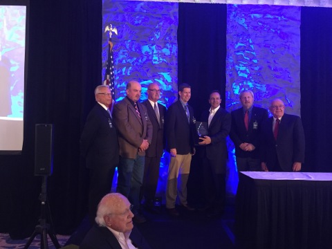 Steve Henry, Hawesville General Manager accepts the Kentucky Manufacturer of the Year award from Governor Matt Bevin. Pictured l to r: Gary Stewart (KAM selection committee member), Brian "Curly" Wettstain (USW Local 1261 Vice President, Maintenance, Hawesville Mill), Greg Batie (USW Local 1261 President, Maintenance, Hawesville Mill), Steve Henry (Hawesville General Manager), Kentucky Governor Matt Bevin, Jack Bray (VP, Pulp & Paper Manufacturing, Domtar), and Greg Higdon (President and CEO of KAM).