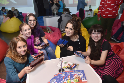 In this photo provided by Nintendo of America, girls play Pokémon Sun and Pokémon Moon for Nintendo 3DS. Game-play activities were part of a larger event hosted by Nintendo, with actress and recording artist Laura Marano at Lightbox in New York on Saturday, Nov. 5. (Photo: Business Wire)