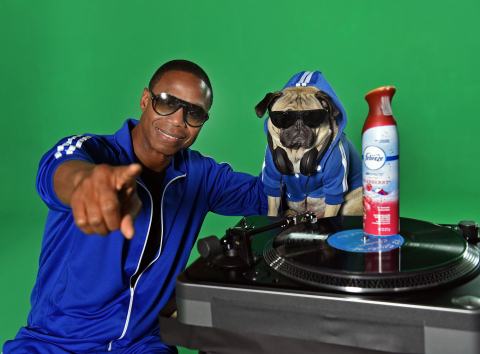 In this image distributed Thursday, Nov. 10, 2016 for Febreze, beatboxer Doug E. Fresh and Instagram star @ItsDougThePug pose on the New York set of their music video for the hip-hop remix of Febreze’s second annual "The #12Stinks of Christmas.” Following the success of last year’s “The #12Stinks of Christmas” music video, this funky fresh remix is available now on YouTube.com/Febreze. (Photo by Diane Bondareff/Invision for Febreze/AP Images)