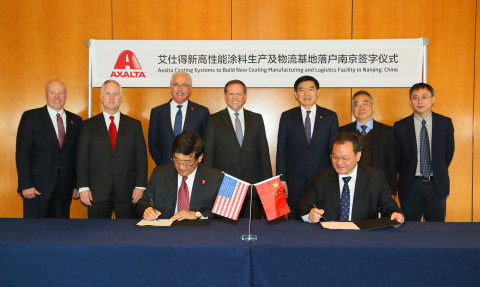 Axalta to build new coating manufacturing and logistics facility in Nanjing, China. Signing: Luke Lu, Axalta Vice President and Greater China President and Zhu Yuanshen, Deputy Director of the Nanjing Chemical Industrial Park (NCIP) Management Committee. Charlie Shaver, Axalta Chairman and CEO, standing center. (Photo: Axalta)