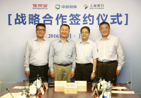 Strategic partnership signing ceremony. From left to right: Zhu Jijin, Shibei Branch manager, Bank of Shanghai; Dr. Zane Wang, CEO, China Rapid Finance; Zhou Ji’an, General Manager, China United SME Guarantee Corp., and Jiang Hong, vice president, Bank of Shanghai. (Photo: Business Wire)