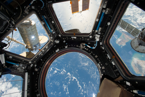 Orbital ATK's Cygnus cargo spacecraft is seen from the Cupola module windows aboard the International Space Station. Credits: NASA