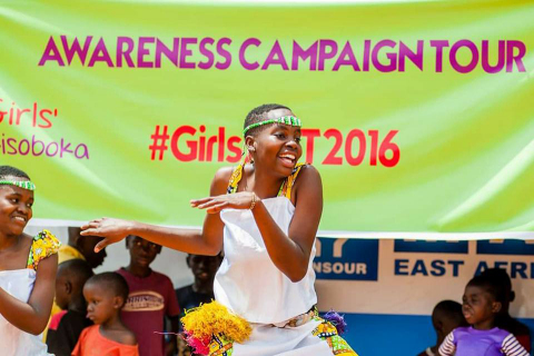 A young girl dances at the launch of Girls ACT in Kampala Uganda. (Photo: Business Wire)