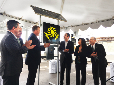 L to R: Allan Schurr, president of Edison Energy; Doug Drummond, commissioner of the Port of Long Beach; Anthony Otto, president of Long Beach Container Terminal; Long Beach Mayor Robert Garcia; Gina Heng, vice president and general manager of Mitsubishi Electric Photovoltaic Division; and James Hankla, senior vice president of governmental relations at PFMG Solar, watch the ceremonial flip of the switch to power on the new 904.75kW solar array at Long Beach Container Terminal.