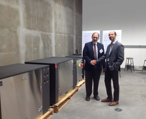 Pictured are Michael Taras, VP of Engineering for ClimateMaster (right), and Dr. Daniel E. Fisher, Head of the Mechanical and Aerospace Engineering Department at the Oklahoma State University in Stillwater, OK, with the donated ClimateMaster units. (Photo: Business Wire)