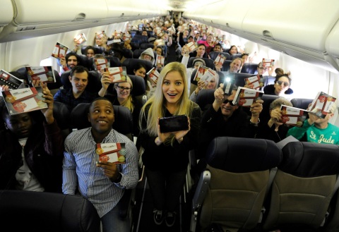 In this photo provided by Nintendo of America, Nintendo surprises passengers on a Southwest Airlines flight from Dallas Love Field to Los Angeles International Airport on Wednesday, Dec. 14. In the air, actress and YouTube celebrity iJustine helped passengers play and create Super Mario levels using Super Mario Maker for Nintendo 3DS. Passengers received a New Nintendo 3DS XL system and a voucher to download Super Mario Maker for Nintendo 3DS from Nintendo eShop. From Dec. 16, 2016 through Jan. 14, 2017, everyone can get in on the fun and enter the Say Yes to Nintendo 3DS sweepstakes for a chance to win a trip to NYC and Nintendo prize packages. (Photo: Business Wire)