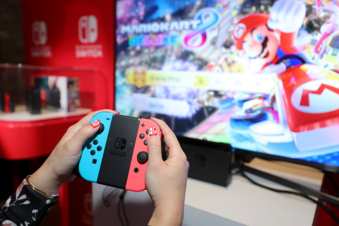 NEW YORK - JAN 13: In this photo provided by Nintendo of America, a guest enjoys playing Mario Kart 8 Deluxe on the groundbreaking new Nintendo Switch video game system at a special preview event in New York on Jan. 13, 2017. Launching March 3, 2017, Nintendo Switch combines the power of a home console with the mobility of a handheld. It's a new era in gaming that delivers entirely new ways to play wherever and whenever people want. (Photo by Neilson Barnard/Getty Images for Nintendo of America)