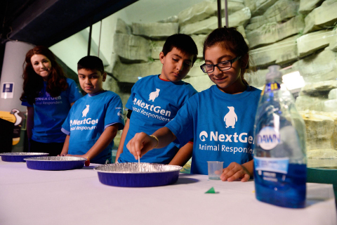 IMAGE DISTRIBUTED BY DAWN - Shedd Aquarium Learning Specialist Sabrina Bainbridge, left to right, watches as Miguel Perez, Manuel Colunga and Rebecca Albarran, all fifth grade students from Telpochcalli Elementary Chicago Public School, participate in a hands-on science experiment as part of the launch of Dawn and Shedd's NextGen Animal Responders program at Shedd Aquarium on Tuesday, Jan. 17, 2017 in Chicago.(Brian Kersey/AP Images for Dawn)
