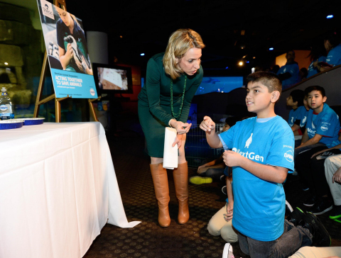 IMAGE DISTRIBUTED BY DAWN - Bridget Coughlin, Shedd Aquarium president and CEO, left, talks with Miguel Perez, a fifth grade student from Telpochcalli Elementary Chicago Public School, as he and his class experience a penguin encounter as part of the launch of Dawn and Shedd's NextGen Animal Responders program at Shedd Aquarium on Tuesday, Jan. 17, 2017 in Chicago. (Brian Kersey/AP Images for Dawn)