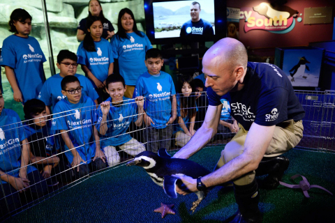 IMAGE DISTRIBUTED BY DAWN - Animal trainer Michael Pratt shows Fifth grade students from Telpochcalli Elementary Chicago Public School a penguin as part of the launch of Dawn and Shedd Aquarium's NextGen Animal Responders program at Shedd Aquarium on Tuesday, Jan. 17, 2017 in Chicago. (Brian Kersey/AP Images for Dawn)