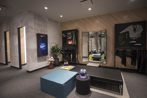 Located on the store's first floor, The Lounge features expanded fitting rooms with adaptive lighting and a treadmill, where consumers can consult with a stylist, and test and purchase products. (Photo: Business Wire)