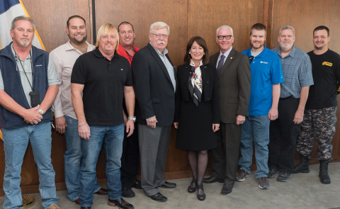 Port Commission Chairman Janiece Longoria (center), Port Commissioner Dean Corgey, G&H Towing President Steve Huffman, pilots and tugboat crew members. During the Port Commission meeting held today, Chairman Longoria recognized the heroic efforts and coordination of all pilots, tugs, fireboats dock personnel and oil spill responders to contain a dangerous fuel spill and fire involving M/T Aframax River crude carrier in Sept. 2016, resulting in no injuries or loss of life, and minimal amount of channel closure. (Photo: Business Wire)