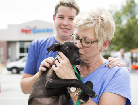 The Ballards give love to their new family member, Kate, who was adopted from a local PetSmart in Ashville, N.C., during a National Adoption Weekend event. PetSmart’s first National Adoption Weekend of 2017 is being held at 1,500-plus PetSmart stores across North America this weekend, Feb. 17-19. (Photo: Business Wire)