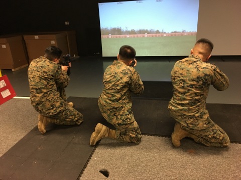 Three U.S. Marines at Camp Upshur, Marine Corps Base Quantico, use the new Indoor Simulated Marksmanship Trainer (ISMT) on January 27, 2017. The first three sites to receive ISMT from Meggitt Training Systems are Camp Upshur, The Basic School, and Weapons Training Battalion. All 670-plus ISMT system deliveries should be completed during the next 18 months. (Photo: Business Wire)