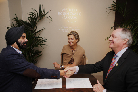 During the World Economic Forum's Annual Meeting in Davos, Her Majesty Queen Maxima of the Netherlands, UN Secretary-General's Special Advocate for Inclusive Finance for Development (center) witnessed Ajay Banga, president and CEO of Mastercard (left), and Paul Polman, Chief Executive of Unilever (right), signing a strategic partnership designed to advance financial inclusion efforts by empowering small and micro businesses in emerging markets. (Photo: Business Wire)