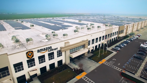 Aerial view of Amazon fulfillment center with solar systems on its rooftop. (Photo: Business Wire)