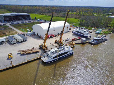 The first CityWide Ferry in the water at Metal Shark's Franklin, Louisiana shipyard, with the second vessel awaiting its turn at the cranes. (Photo credit: Workboat)