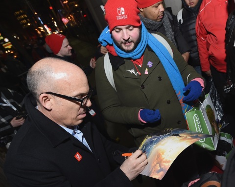 In this photo provided by Nintendo of America, Doug Bowser, Senior Vice President Sales and Marketing, greets eager fans lined up outside the Nintendo NY store on March 3. (Photo: Nintendo of America)