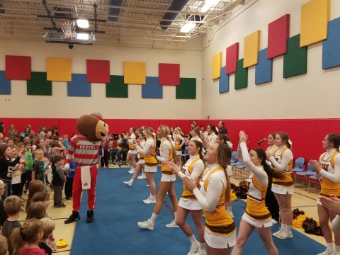 Brutus Buckeye was joined by cheerleaders from West Jefferson High School at Norwood Elementary in West Jefferson today for a school assembly to celebrate Norwood receiving a $20,000 PLAYMAKERS grant from UnitedHealthcare. PLAYMAKERS, created by UnitedHealthcare with support from Ohio State IMG Sports Marketing and 97.1 The Fan, promotes sports, physical activity and active play at elementary schools across Ohio (Photo courtesy of UnitedHealthcare).