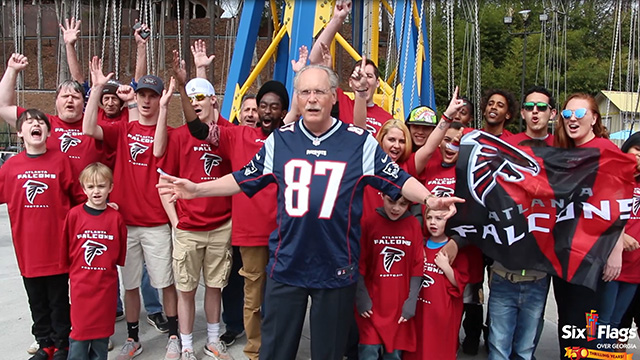 Feature Package - Six Flags Over Georgia near Atlanta opens for its 50th anniversary season by fulfilling its big game bet with sister park, Six Flags New England. Park President Dale Kaetzel wore a Patriots jersey and was surrounded by 31 other fans wearing Falcons shirts on the 240-foot tall thrilling swing ride, renamed for the weekend as, the Patriots SkyScreamer. The park is also serving a limited amount of New England clam chowder to All Season Dining Plan guests during opening weekend. (Photo: Six Flags Over Georgia)