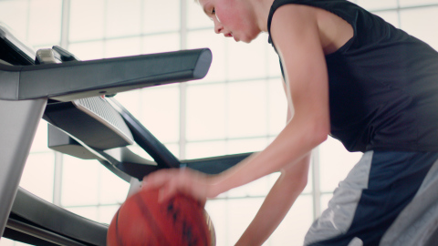 Young basketball star Luke Facer showcases his ball handling skills while jogging forward, backward and turning 360s on a ProForm treadmill, in a new campaign celebrating March Madness. (Photo: Business Wire)