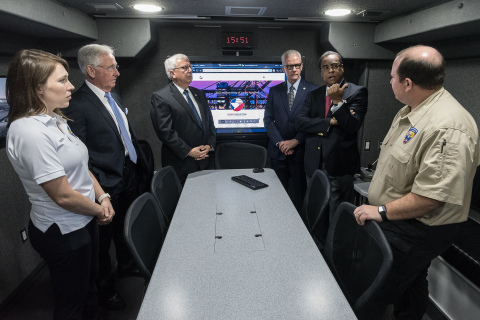 Members of Port Houston Emergency Management Team provide Port Commissioners tour of the new Mobile Command Center. Port Commissioner Theldon Branch (middle right) asks Port Houston Emergency Manager Colin Rizzo (far right) question during demonstration. (From left to right) Port Emergency Preparedness Coordinator Jessie Dowda, Port Commissioners Clyde Fitzgerald, John D. Kennedy and Dean Corgey. (Photo: Business Wire)
